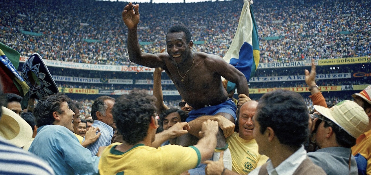 Pele lifted on shoulders inside the Azteca stadium after Brazil won its third World Cup in 1970